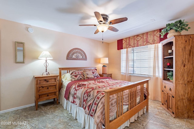 503 S Paseo Lobo Unit A, Green Valley, AZ 85614 - bedroom featuring baseboards and ceiling fan