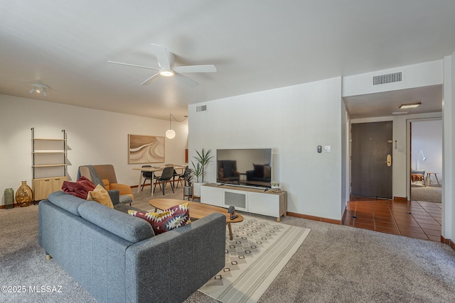 3940 E Timrod St Unit 226, Tucson, AZ 85711 - carpeted living room featuring ceiling fan and baseboards