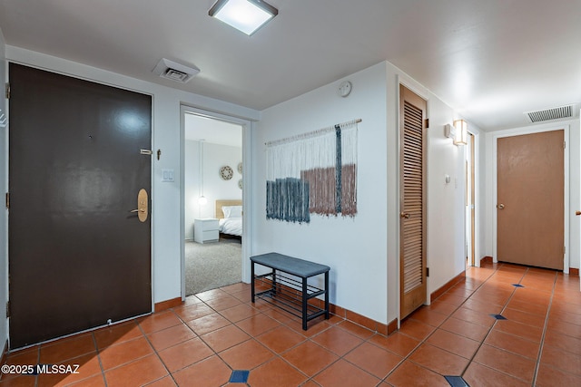 3940 E Timrod St Unit 226, Tucson, AZ 85711 - hallway featuring tile patterned flooring and baseboards
