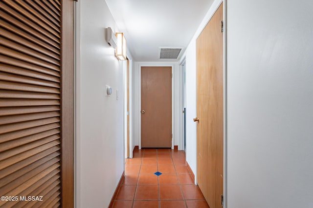 3940 E Timrod St Unit 226, Tucson, AZ 85711 - hall featuring light tile patterned flooring, baseboards, and a heating unit