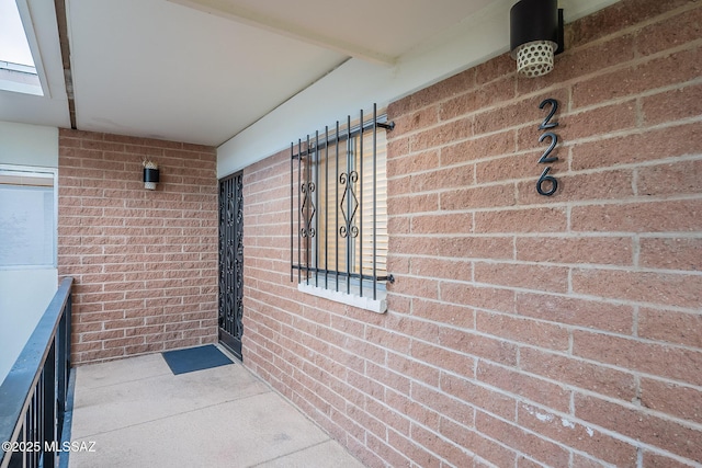 3940 E Timrod St Unit 226, Tucson, AZ 85711 - doorway to property featuring brick siding