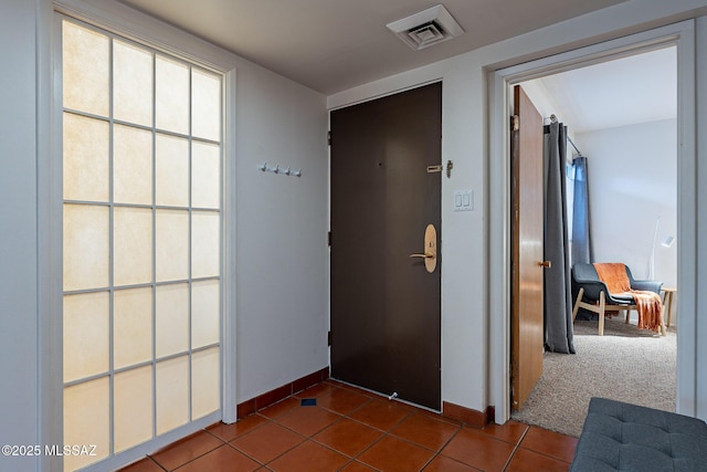 3940 E Timrod St Unit 226, Tucson, AZ 85711 - corridor with dark tile patterned floors and baseboards