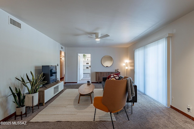 3940 E Timrod St Unit 226, Tucson, AZ 85711 - carpeted living area with baseboards and ceiling fan