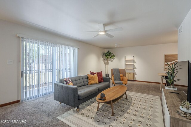 3940 E Timrod St Unit 226, Tucson, AZ 85711 - carpeted living room with a ceiling fan and baseboards