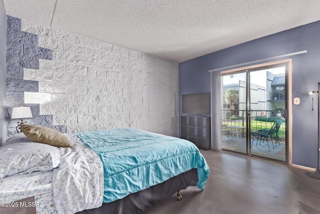 7777 E Golf Links Rd Unit 2105, Tucson, AZ 85730 - bedroom with access to exterior, concrete flooring, and a textured ceiling