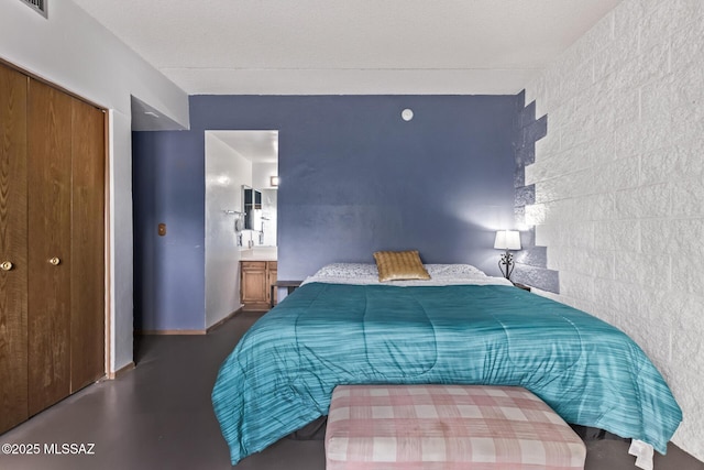 7777 E Golf Links Rd Unit 2105, Tucson, AZ 85730 - bedroom with finished concrete floors and a closet