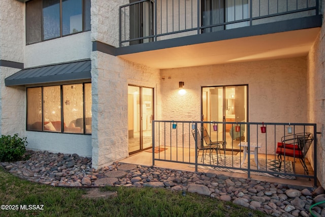 7777 E Golf Links Rd Unit 2105, Tucson, AZ 85730 - view of exterior entry featuring stucco siding and a patio