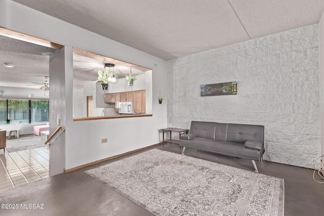 7777 E Golf Links Rd Unit 2105, Tucson, AZ 85730 - living room with a textured ceiling, concrete floors, and ceiling fan