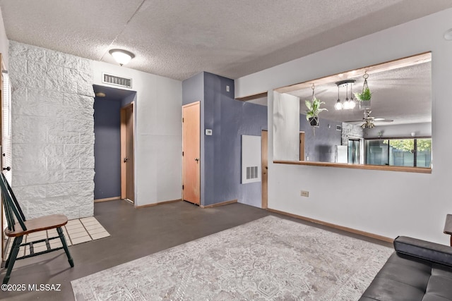 7777 E Golf Links Rd Unit 2105, Tucson, AZ 85730 - living area with a textured ceiling, a ceiling fan, and finished concrete flooring