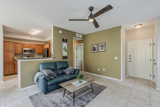 1500 E Pusch Wilderness Dr Unit 15205, Oro Valley, AZ 85737 - living area with ceiling fan and light tile patterned floors