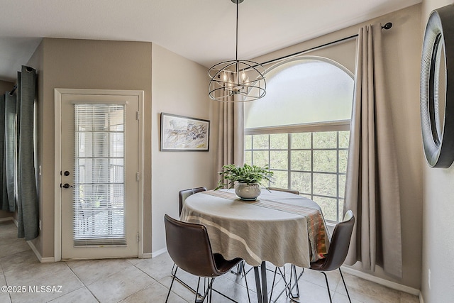 1500 E Pusch Wilderness Dr Unit 15205, Oro Valley, AZ 85737 - dining space with a chandelier and light tile patterned flooring