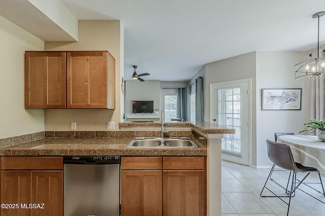 1500 E Pusch Wilderness Dr Unit 15205, Oro Valley, AZ 85737 - kitchen with dishwasher, tile counters, brown cabinetry, a peninsula, and ceiling fan