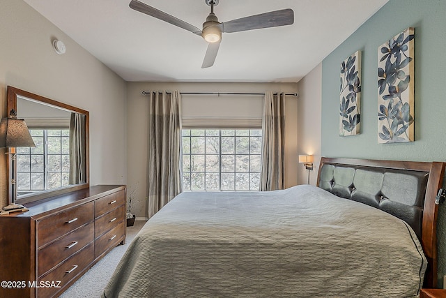 1500 E Pusch Wilderness Dr Unit 15205, Oro Valley, AZ 85737 - bedroom featuring multiple windows, carpet, and ceiling fan