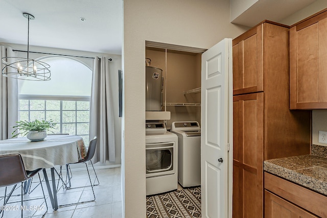 1500 E Pusch Wilderness Dr Unit 15205, Oro Valley, AZ 85737 - laundry area featuring independent washer and dryer, light tile patterned floors, a chandelier, and water heater