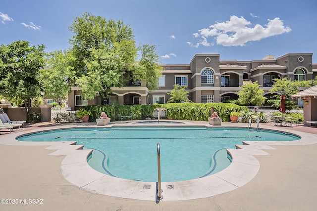 1500 E Pusch Wilderness Dr Unit 15205, Oro Valley, AZ 85737 - community pool featuring a hot tub and a patio