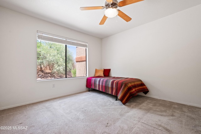 7255 E Snyder Rd Unit 9103, Tucson, AZ 85750 - carpeted bedroom featuring baseboards and a ceiling fan