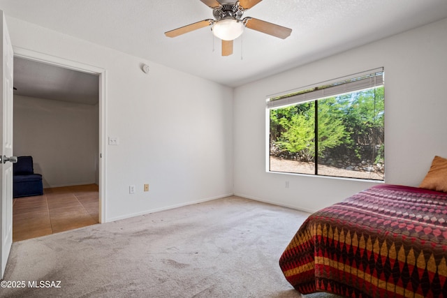 7255 E Snyder Rd Unit 9103, Tucson, AZ 85750 - carpeted bedroom with baseboards and a ceiling fan
