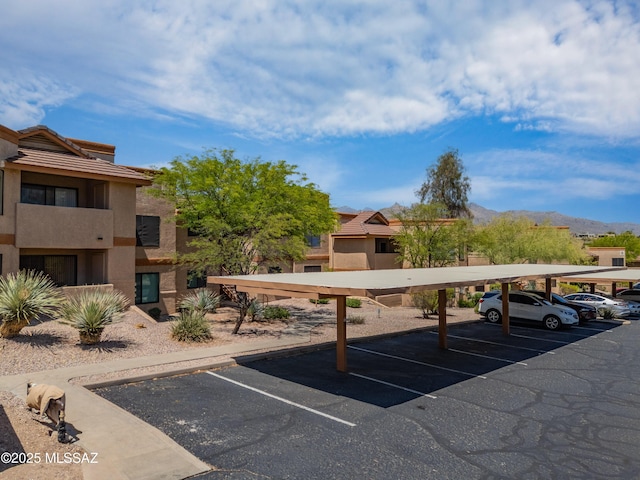 7255 E Snyder Rd Unit 9103, Tucson, AZ 85750 - partially covered parking lot featuring a mountain view
