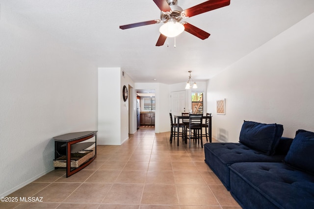 7255 E Snyder Rd Unit 9103, Tucson, AZ 85750 - living room with light tile patterned floors and ceiling fan