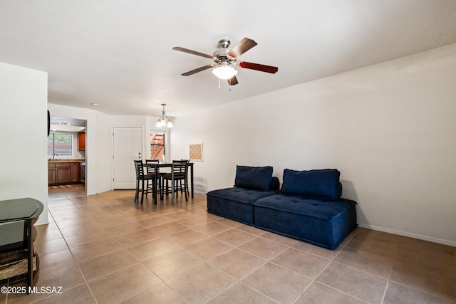 7255 E Snyder Rd Unit 9103, Tucson, AZ 85750 - living area with ceiling fan, light tile patterned flooring, and a chandelier