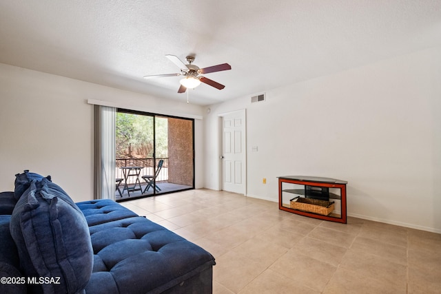 7255 E Snyder Rd Unit 9103, Tucson, AZ 85750 - living room featuring ceiling fan, light tile patterned flooring, and a textured ceiling
