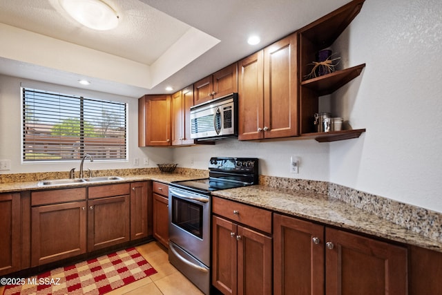 7255 E Snyder Rd Unit 9103, Tucson, AZ 85750 - kitchen with stainless steel appliances, open shelves, light stone countertops, light tile patterned floors, and recessed lighting