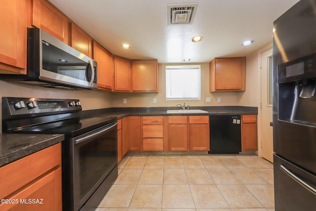 1641 S San Carla, Green Valley, AZ 85614 - kitchen with range with electric stovetop, stainless steel microwave, dishwasher, fridge with ice dispenser, and light tile patterned floors