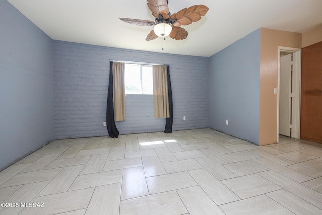 1641 S San Carla, Green Valley, AZ 85614 - unfurnished room with ceiling fan and brick wall