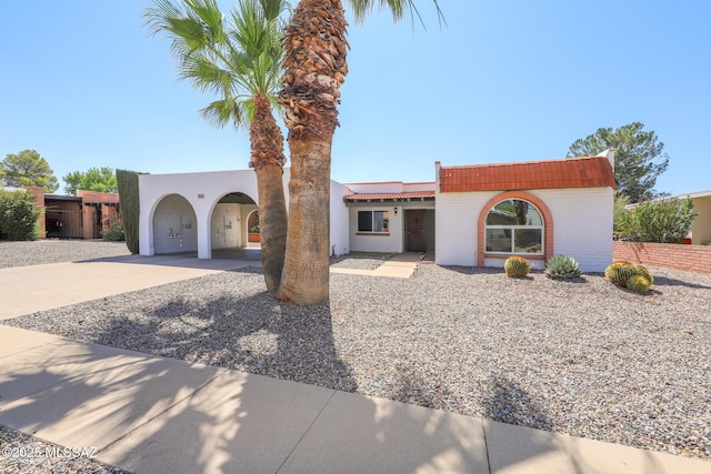 1641 S San Carla, Green Valley, AZ 85614 - mediterranean / spanish home featuring concrete driveway, stucco siding, and a carport
