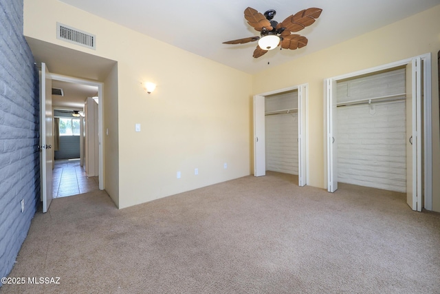 1641 S San Carla, Green Valley, AZ 85614 - unfurnished bedroom featuring multiple closets and carpet flooring