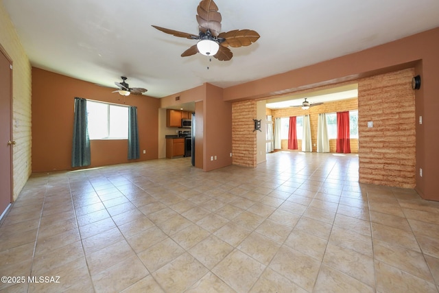 1641 S San Carla, Green Valley, AZ 85614 - unfurnished living room featuring ceiling fan and light tile patterned floors