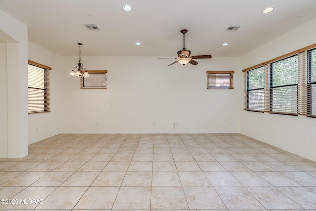 139 E Castlefield Cir, Tucson, AZ 85704 - unfurnished room with ceiling fan, a chandelier, and recessed lighting