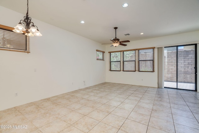 139 E Castlefield Cir, Tucson, AZ 85704 - spare room with ceiling fan, healthy amount of natural light, recessed lighting, and a chandelier