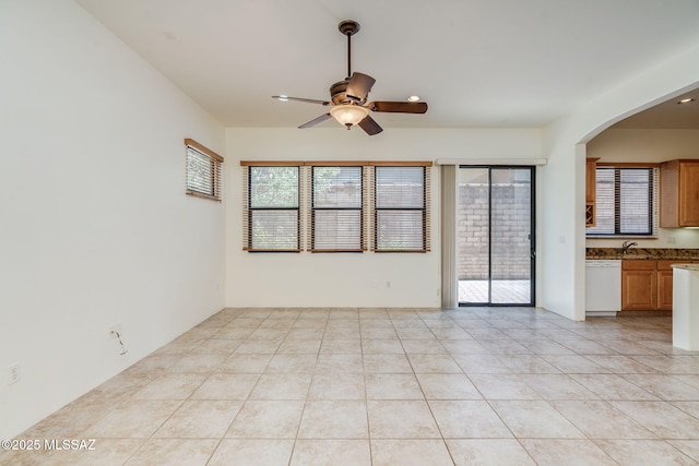 139 E Castlefield Cir, Tucson, AZ 85704 - unfurnished room featuring ceiling fan, healthy amount of natural light, arched walkways, light tile patterned floors, and recessed lighting