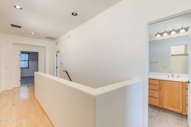 139 E Castlefield Cir, Tucson, AZ 85704 - corridor featuring recessed lighting, an upstairs landing, and light wood finished floors