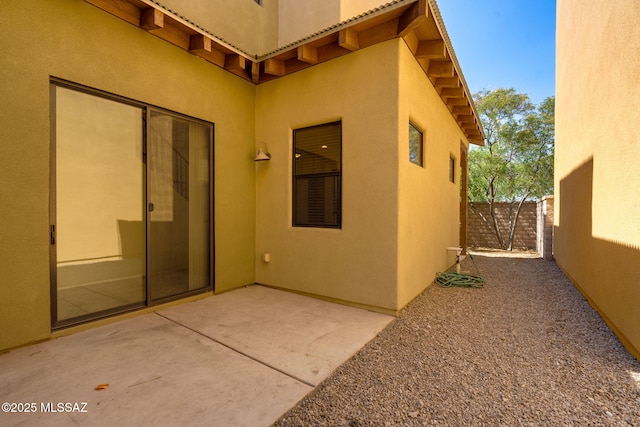 139 E Castlefield Cir, Tucson, AZ 85704 - view of exterior entry featuring stucco siding, a patio, and a tile roof