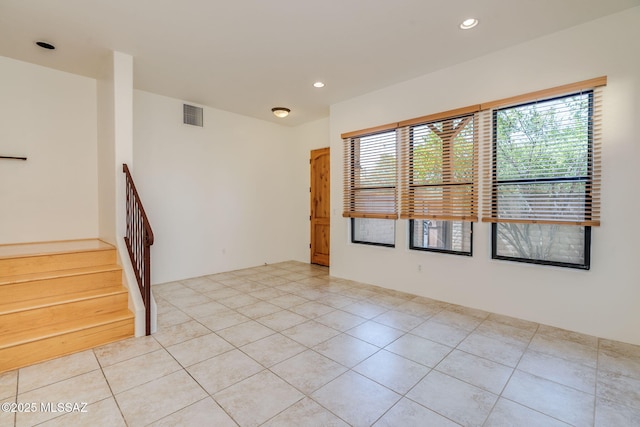 139 E Castlefield Cir, Tucson, AZ 85704 - unfurnished room with light tile patterned floors, stairs, and recessed lighting