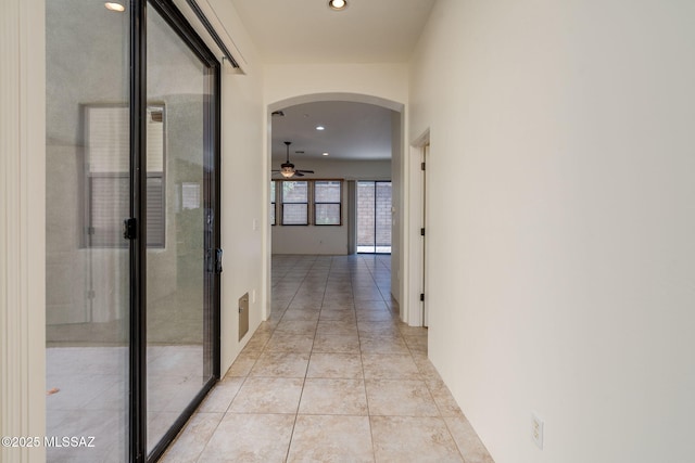 139 E Castlefield Cir, Tucson, AZ 85704 - corridor with arched walkways, recessed lighting, light tile patterned floors, and french doors