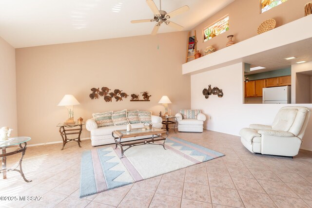 1857 W Dalehaven Cir, Tucson, AZ 85704 - living area with light tile patterned floors, a ceiling fan, and vaulted ceiling