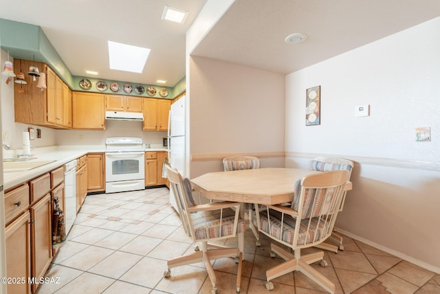 1857 W Dalehaven Cir, Tucson, AZ 85704 - kitchen with white appliances, range hood, light tile patterned floors, and light countertops