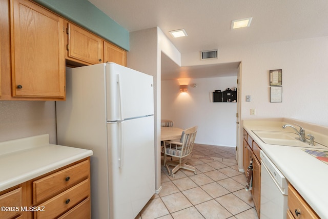 1857 W Dalehaven Cir, Tucson, AZ 85704 - kitchen with white appliances, light countertops, and light tile patterned floors