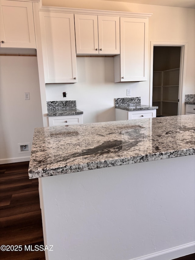 3152 E Andrada Rd, Vail, AZ 85641 - kitchen with stone counters, dark wood-style flooring, and white cabinets