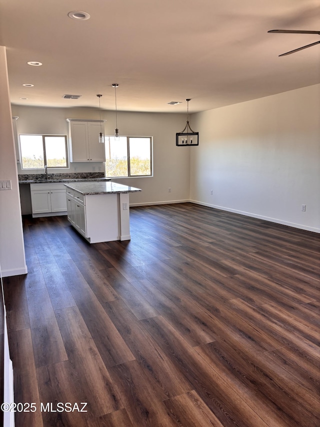 3152 E Andrada Rd, Vail, AZ 85641 - kitchen featuring healthy amount of natural light, dark wood-style flooring, recessed lighting, a center island, and decorative light fixtures