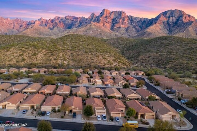 2257 E Skipping Rock Way, Tucson, AZ 85737 - aerial overview of property's location featuring a mountain backdrop and nearby suburban area