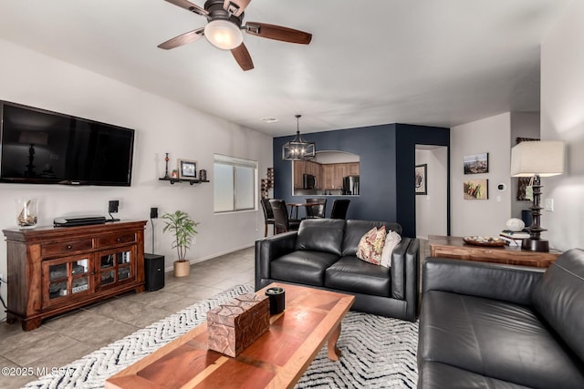 2257 E Skipping Rock Way, Tucson, AZ 85737 - living area featuring ceiling fan, light tile patterned floors, and a chandelier