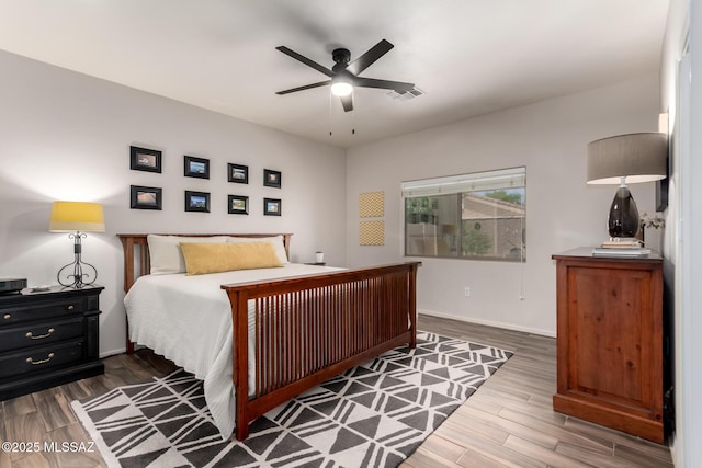 2257 E Skipping Rock Way, Tucson, AZ 85737 - bedroom featuring wood finished floors and a ceiling fan