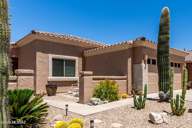 2257 E Skipping Rock Way, Tucson, AZ 85737 - view of front of property with a garage, stucco siding, driveway, and a tiled roof