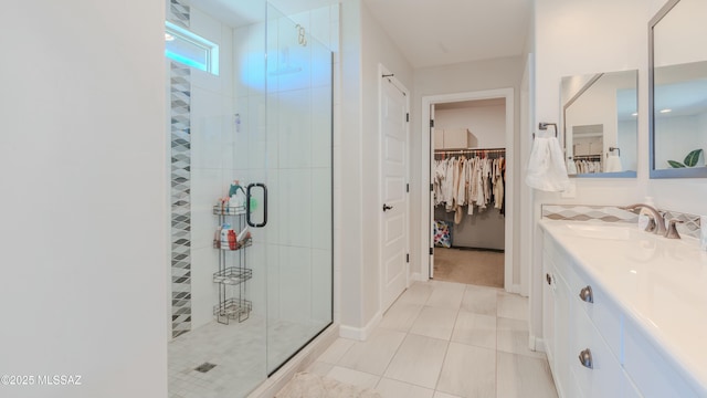14149 E Via Cerro Del Molino, Vail, AZ 85641 - bathroom featuring a shower stall, a walk in closet, vanity, and tile patterned floors