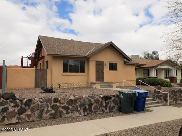 1048 E 7th St, Tucson, AZ 85719 - view of front of property featuring stucco siding and roof with shingles
