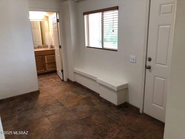 1048 E 7th St, Tucson, AZ 85719 - mudroom featuring stone finish flooring and a sink